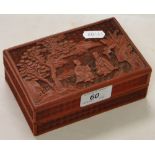 A carved Oriental cinnabar box.