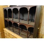 An Antique oak 2-tier hanging cabinet with arched decoration.