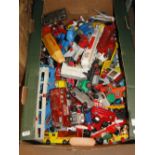 A boxful of die-cast cars, tractors, etc.
