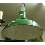 A green enamelled industrial ceiling light.