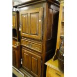 An Antique French fruit wood cupboard with fitted drawer.