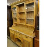 A polished pine 2-section dresser.