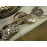 4 Various silver backed dressing table brushes and mirrors.