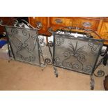 2 scrolled wrought-iron and mesh firescreens.