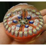 A millefiore glass paperweight.