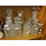 Cut-glass decanters and stoppers.