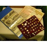 Album of postcards, postage stamp album and a display of badges.