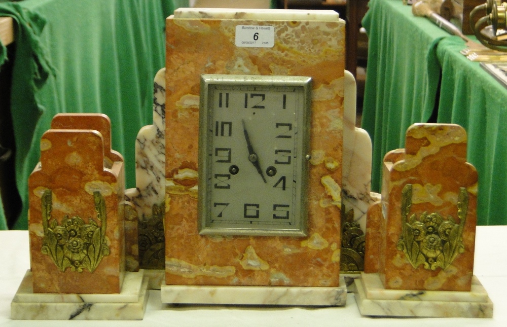 An Art Deco French coloured marble 3-piece clock garniture.