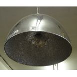 A polished steel hanging lamp.