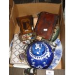 A box with ginger jar, charger, tin of buttons, etc.