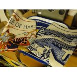 A Battle of Hastings tea towel, another and a bar tray.