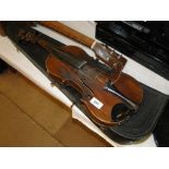 A violin and case with 2 bows.