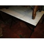 A grey and white veined rectangular marble top garden table on metal base.