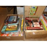 2 Large boxes of jigsaws and board games.