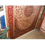 A beige ground Keshan rug, 1.9M x 1.4M.