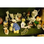 A Coalport Paddington Bear, a Goebels cat accordionist, and other small figures.