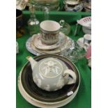 Decanter, teaset and decorative plates.