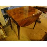 An Edwardian mahogany Pembroke table with end frieze drawer, square tapered legs.