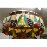 A large Tiffany style lead light lamp shade with design of fruit.