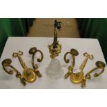 A pair of cast gilt brass twin branch wall lamps and another.