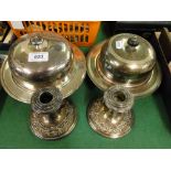 Pair of silver plate on copper candlesticks and 2 silver plated muffin dish and covers.