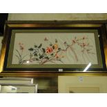 An Oriental needlework on silk, study of flowers and birds.