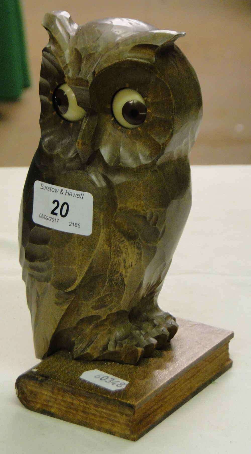 A Vintage carved wood owl clock with moving eyes.