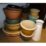 A quantity of glazed and terracotta garden pots.