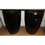 Pair of large black glazed garden pots.