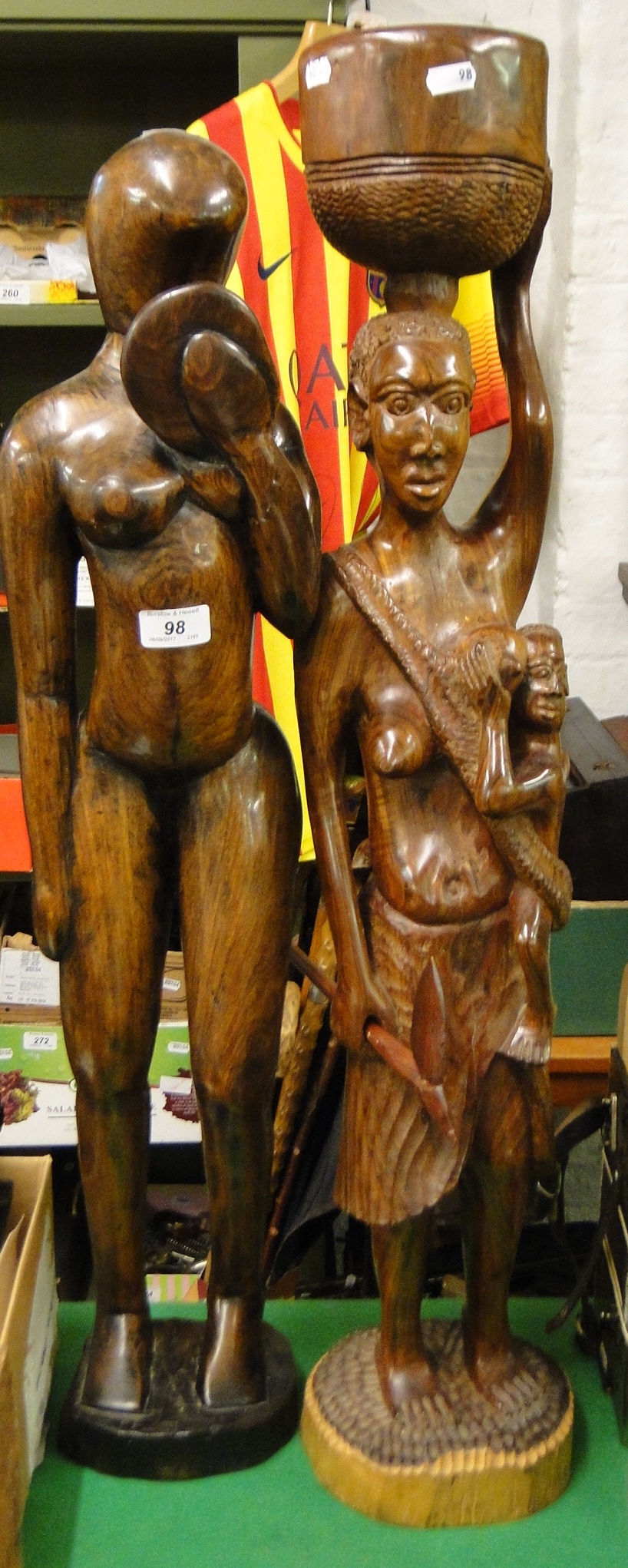 A pair of tall carved hardwood African figures.