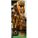 A pair of tall carved hardwood African figures.