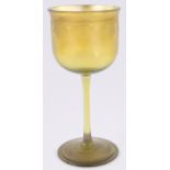 A Louis Comfort Tiffany Favrille wine glass, circa 1920, with engraved grapevine frieze,