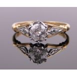 A 0.75ct solitaire diamond ring, 18ct gold and platinum settings, size T.