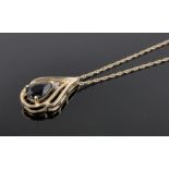 A 14ct gold sapphire and diamond set pendant on gold chain, pendant length 21mm.