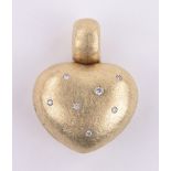 An 18ct gold textured finished 3-dimensional heart shaped pendant set with small diamonds,