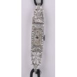 A lady's Art Deco platinum and diamond set cocktail wristwatch, case width 10mm, working order.