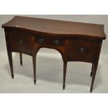 A George III mahogany serpentine front sideboard, on tapered legs, width 4'7".