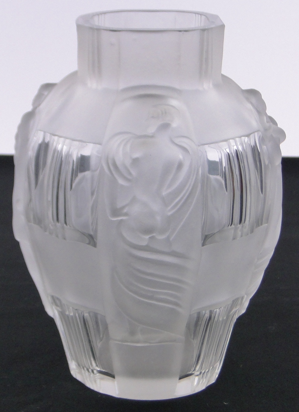 A Desna Art Deco moulded frosted glass vase, with relief stylised figures, etched signature,