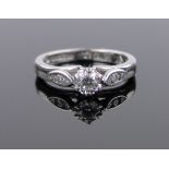 An 18ct white gold 0.25ct solitaire diamond ring, size H.