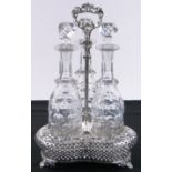 An electroplate 3 bottle decanter stand, with pierced sides and grapevine moulded edge,