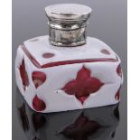 A small 19th century Bohemian Cranberry and milk overlay glass perfume bottle with silver top,