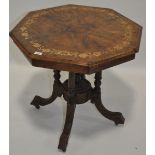 A Victorian walnut and marquetry inlaid octagonal table on carved base, 29" across.