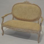 A reproduction French carved and painted wood framed parlour sofa,
