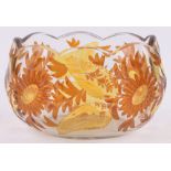 A Bohemian amber overlay glass bowl, wheel-cut floral designs, length 17cm, height 11cm.
