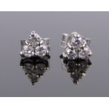 Pair of small 18ct white gold 3 stone diamond ear studs, setting 5mm across.