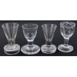 3 18th century firing glasses and 1 other glass, all circa 1745, largest height 10cm, (4).