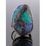 A large 14ct gold and natural opal set ring, setting height 30mm, 15.9g, size L.