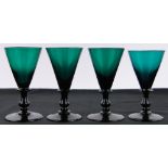 A set of 4 19th century Bristol green wine glasses, height 13cm, diameter 7cm.