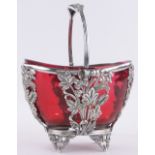 A Victorian electroplate sugar basket, with original Cranberry glass liner and swing handle,