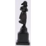 A patinated bronze sculpture of a young Dutch girl, circa 1900, indistinctly signed on the base,